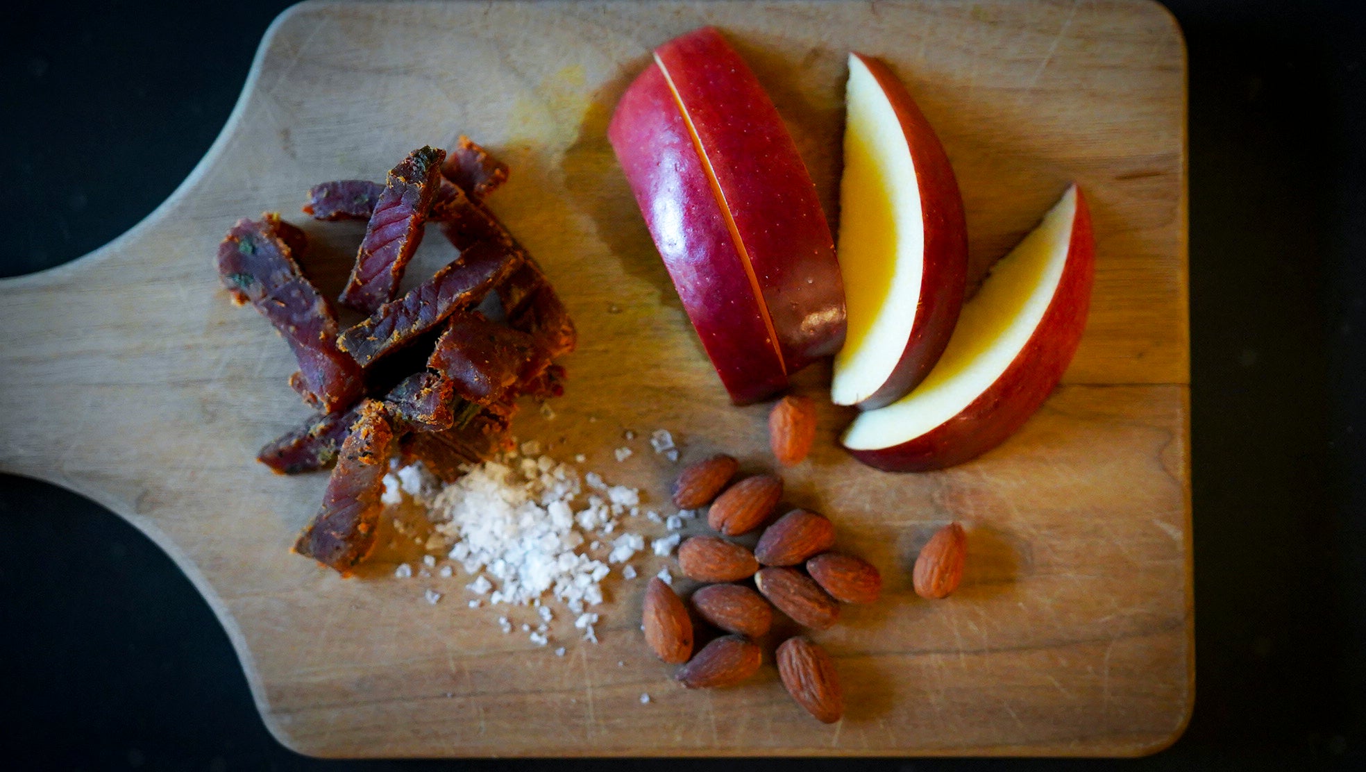 image of apple slices, almonds, and salmon jerky